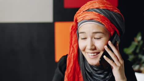 Woman-in-Hijab-Talking-on-Phone